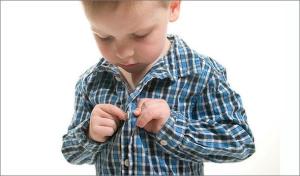 child-getting-dressed